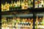 whiskey bottles in cabinet alternative investments